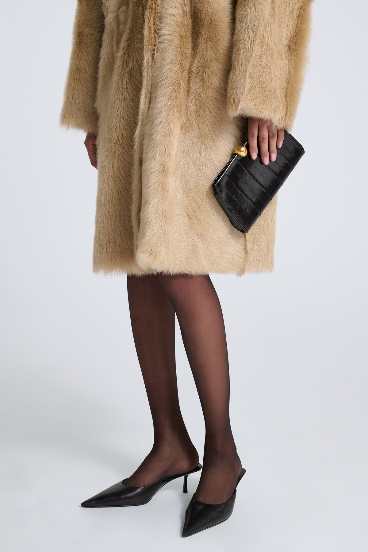 Model is Wearing Nour Hammour Lou Jewelry Eel Leather Clutch Glossy Black Eel - Front