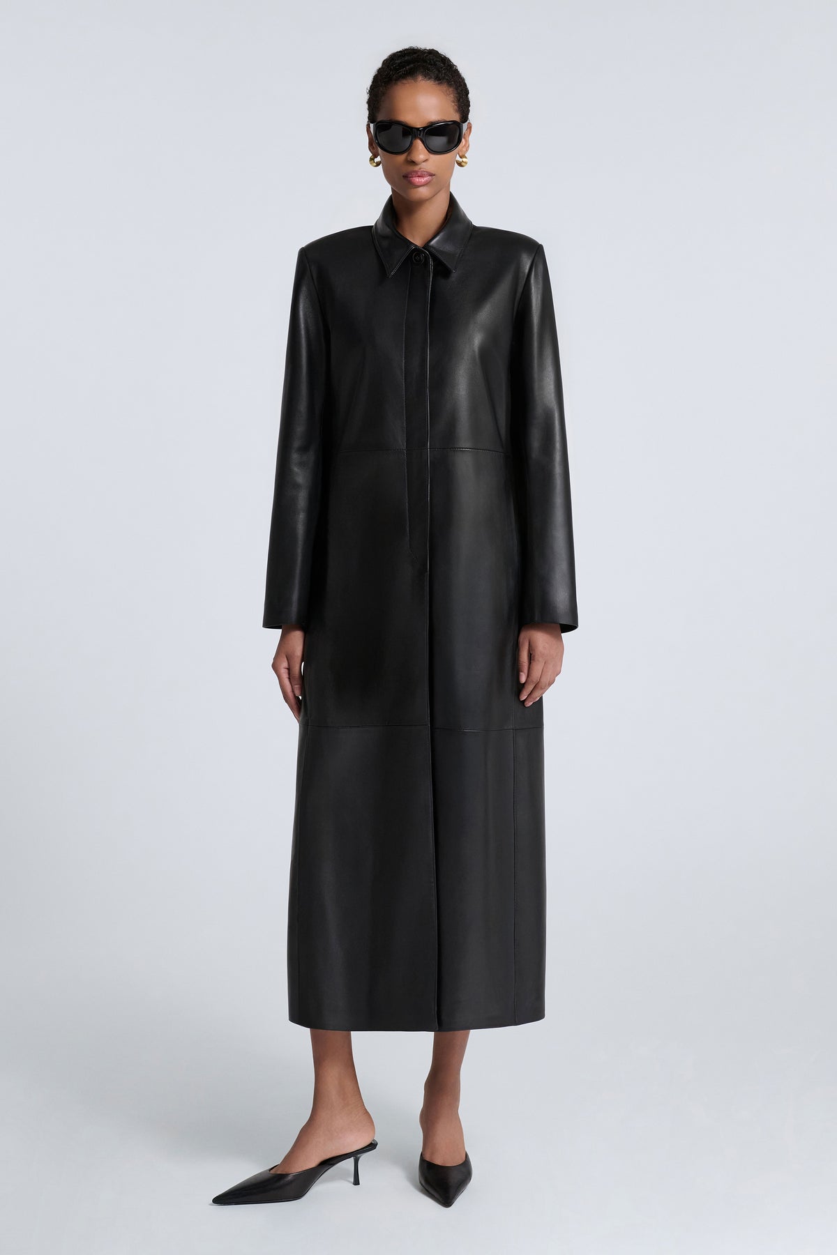 Model is Wearing Nour Hammour Gotham 90s Longline Leather Coat Black - Front