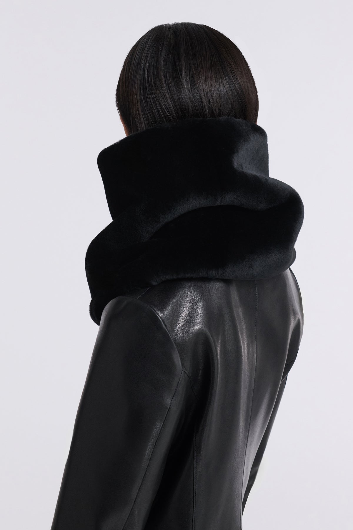 Model is Wearing Nour Hammour Neck Cocoon Plush Shearling Scarf Black - Back