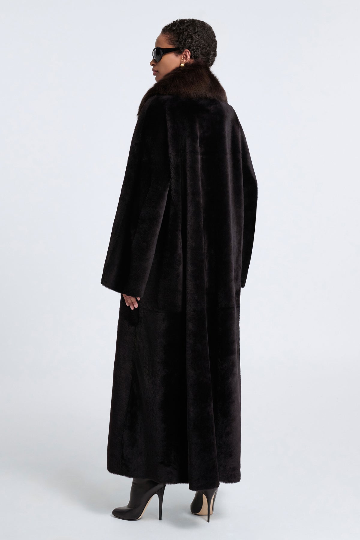 Model is Wearing Nour Hammour Astoria Sweeping Shearling Coat Black Brown - Back