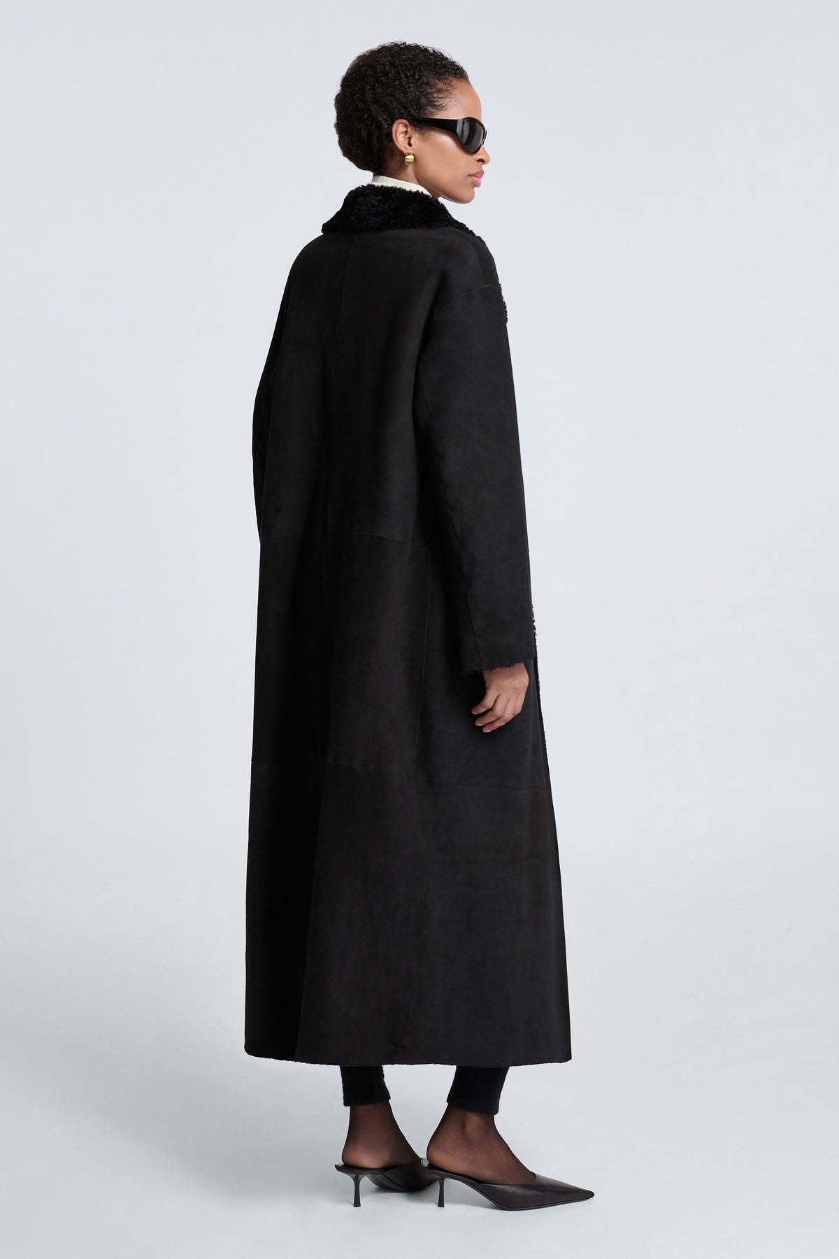 Model is Wearing Nour Hammour Birthday Coat Shearling Blanket Coat Black - Back