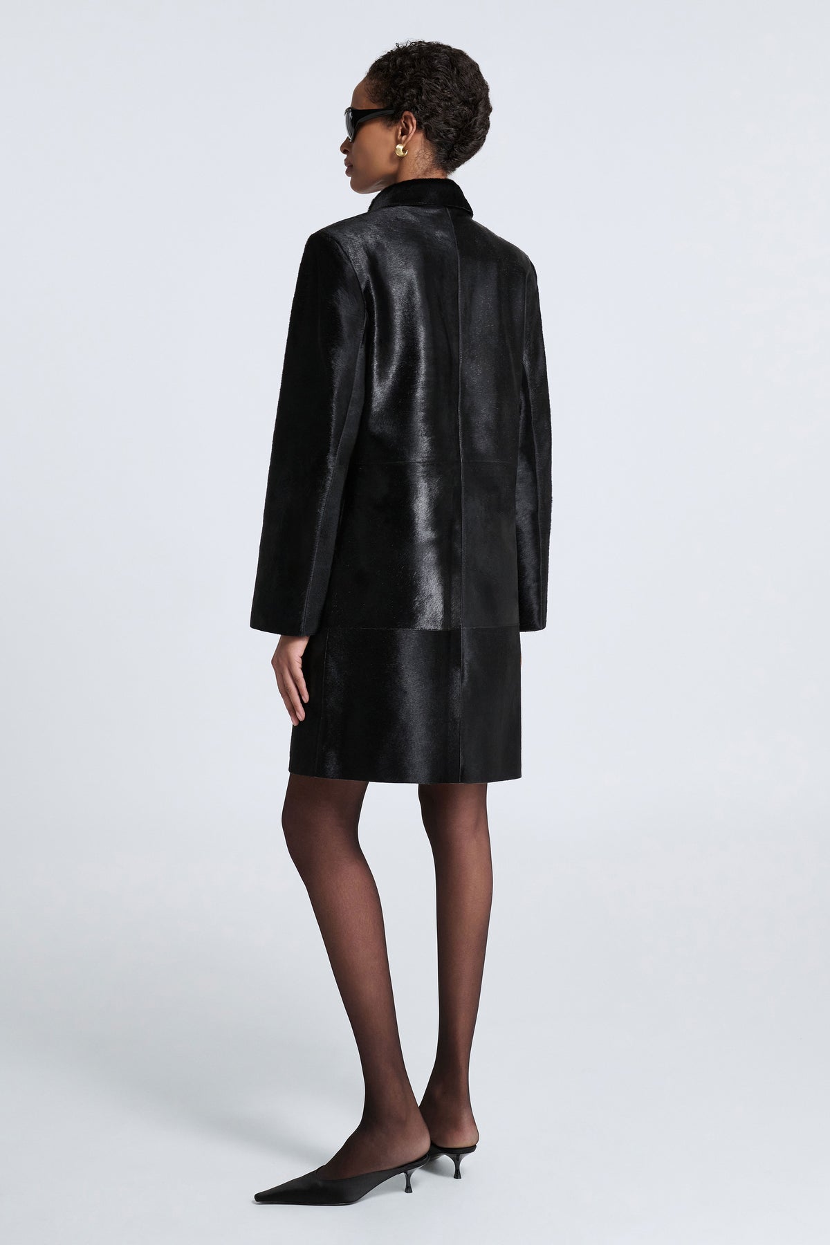 Model is Wearing Nour Hammour Stella Ponyhair Day Coat Obsidian Black - Three Quarters Back
