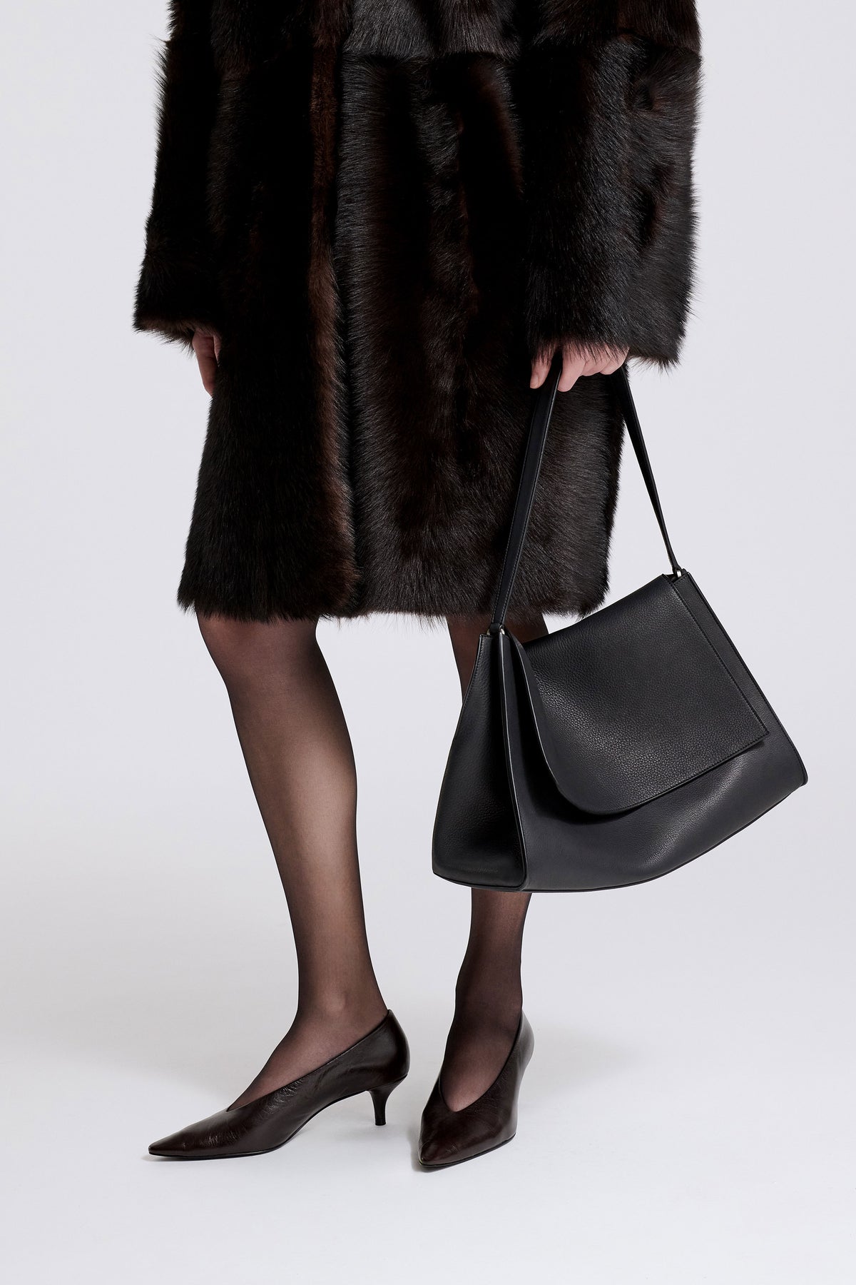 Model is Wearing Nour Hammour Amal Everyday Bag Black Leather - Three Quarters