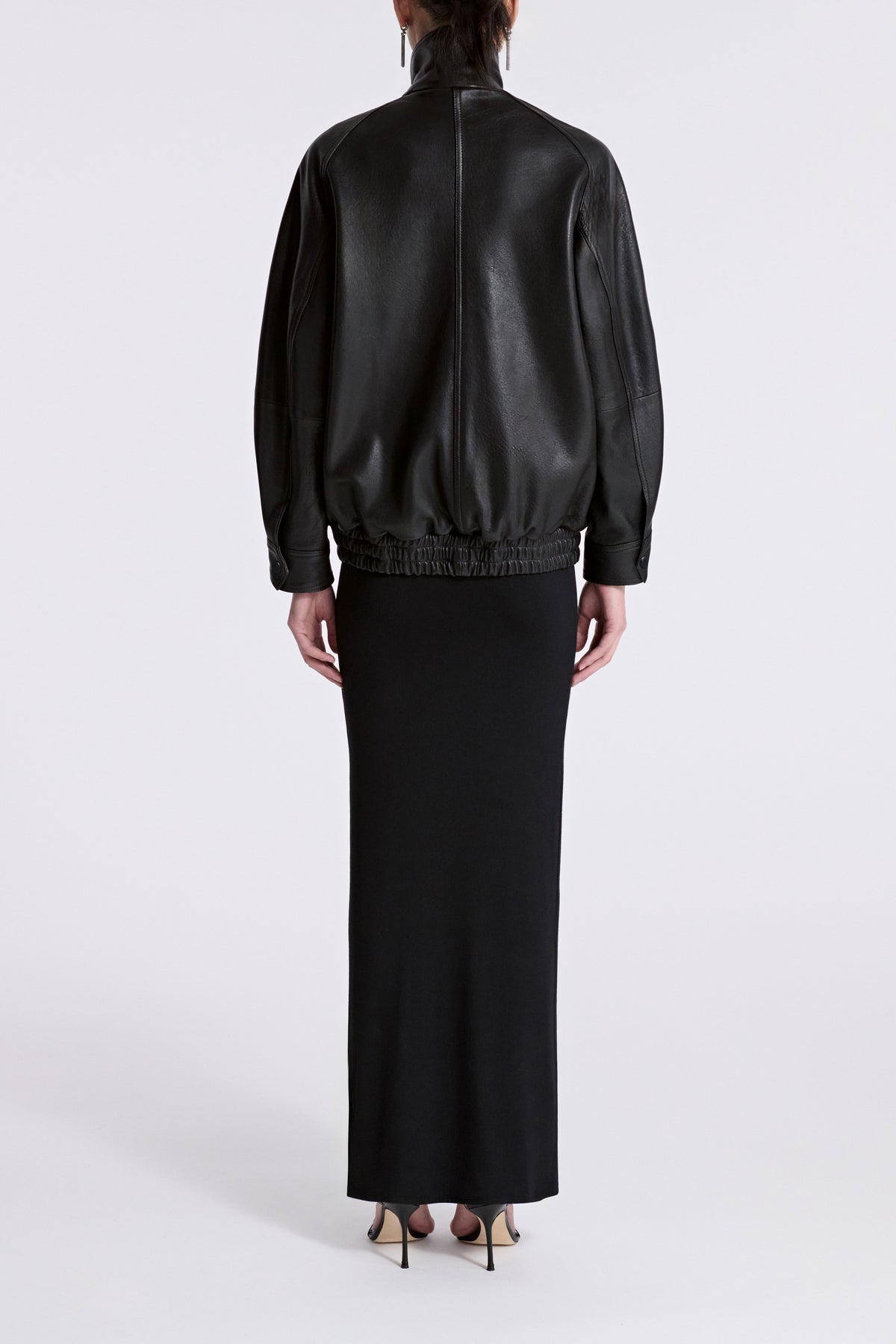 Model is Wearing Nour Hammour Ariste Funnel Leather Bomber Black - Back