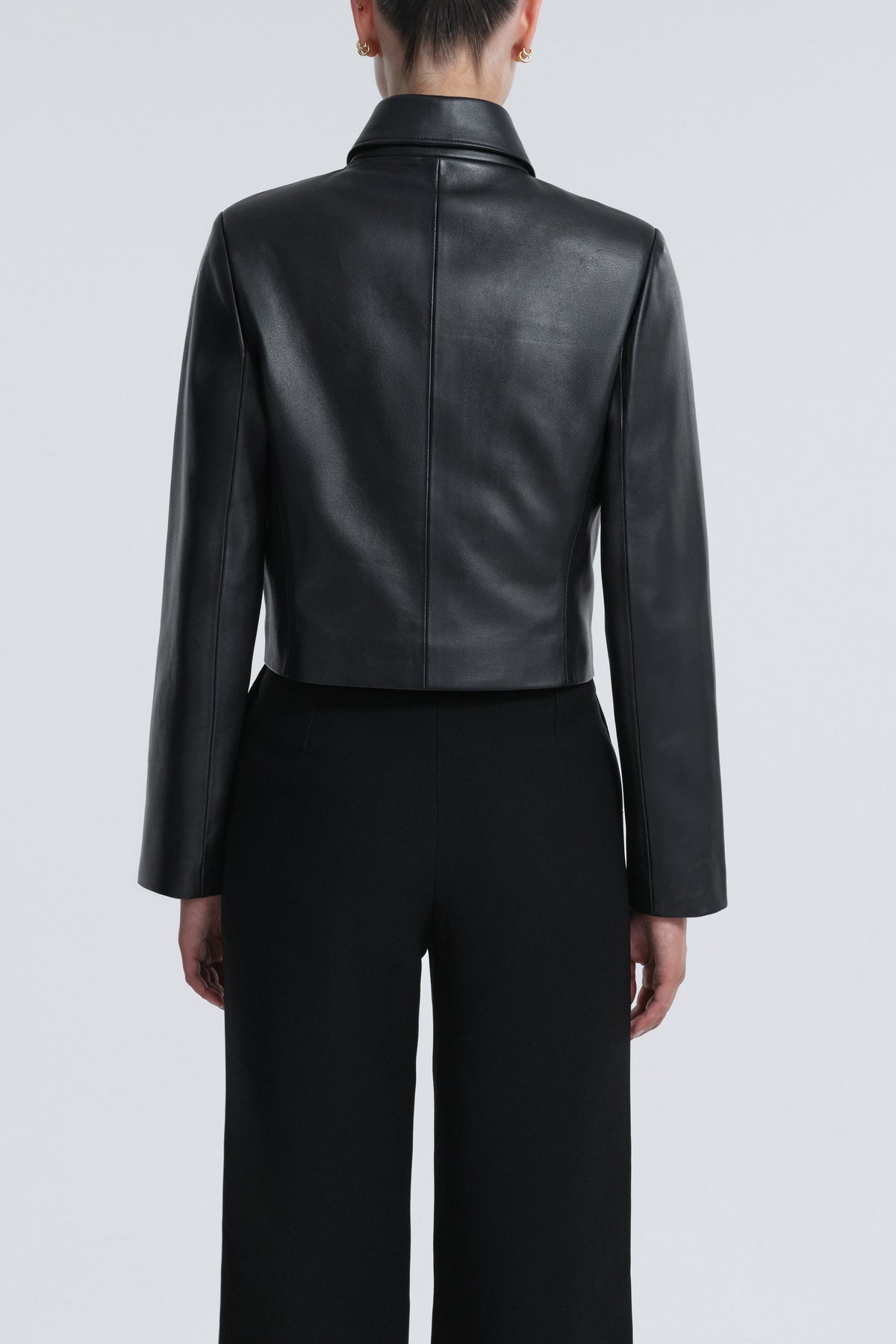 Model is Wearing Nour Hammour Bleeker Minimal Leather Jacket Black - Back