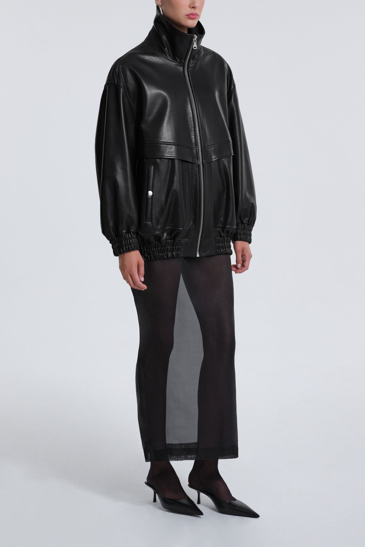 Model is Wearing Nour Hammour Beck Modern Leather Bomber Black - Three Quarters