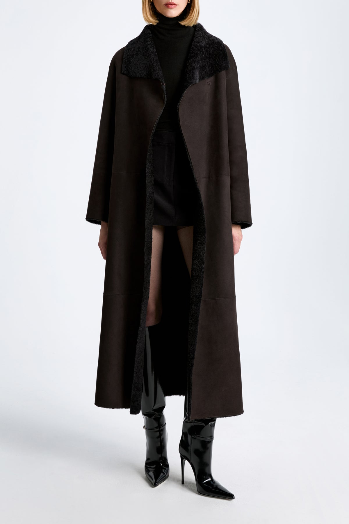 Model is Wearing Nour Hammour Birthday Coat Draped Shearling Coat Brown Black - Front Open 
