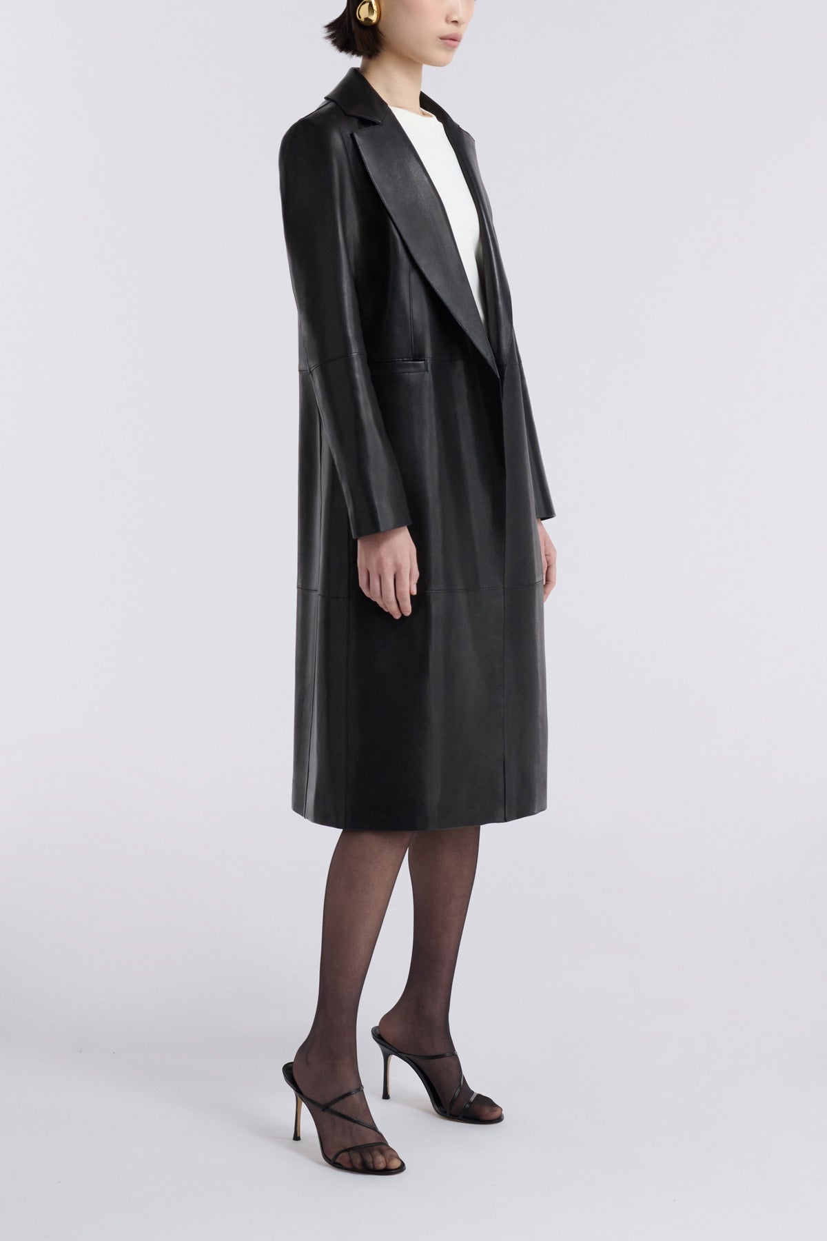 Model is Wearing the Nour Hammour Claude Effortless Leather Coat Noir Classique - Three Quarters