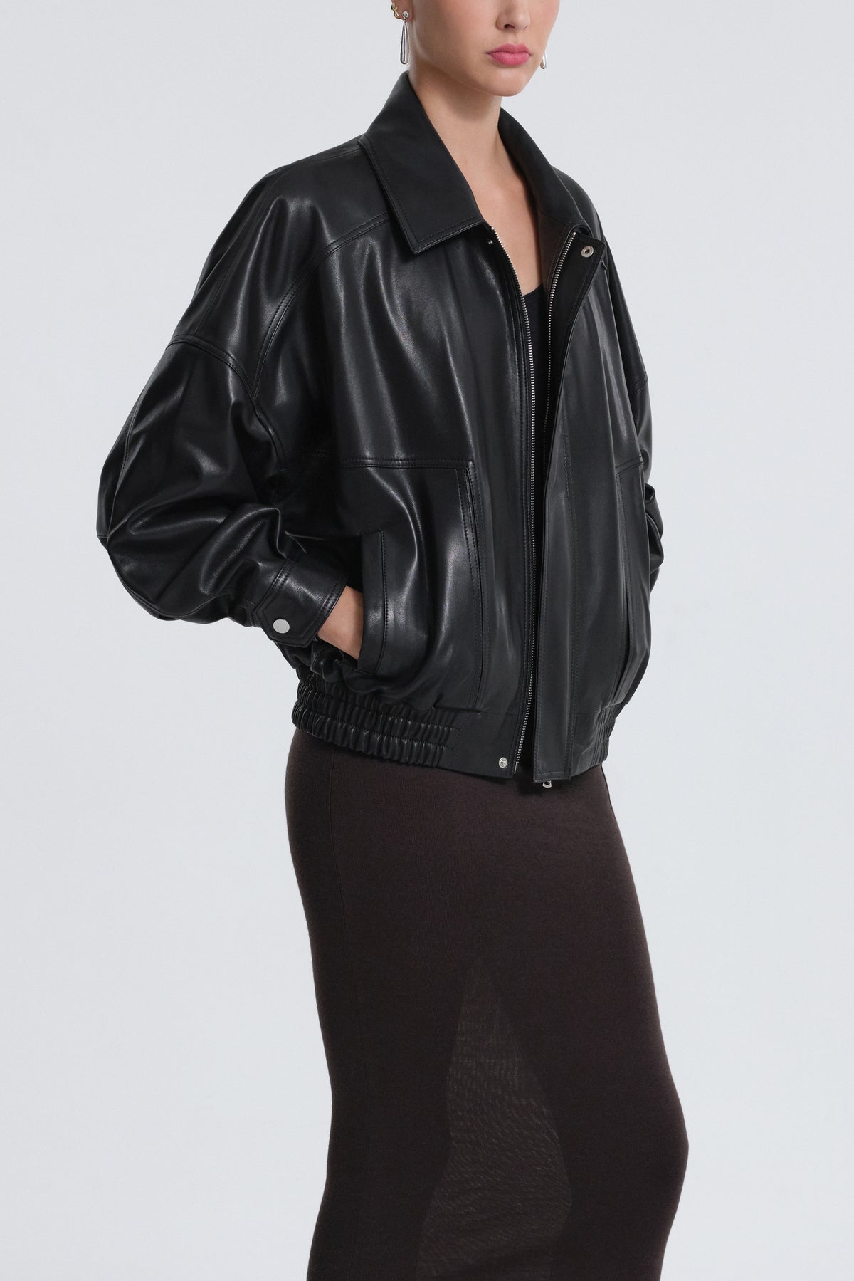Model is Wearing Nour Hammour Dalma Menswear Leather Bomber Black - Three Quarters Open