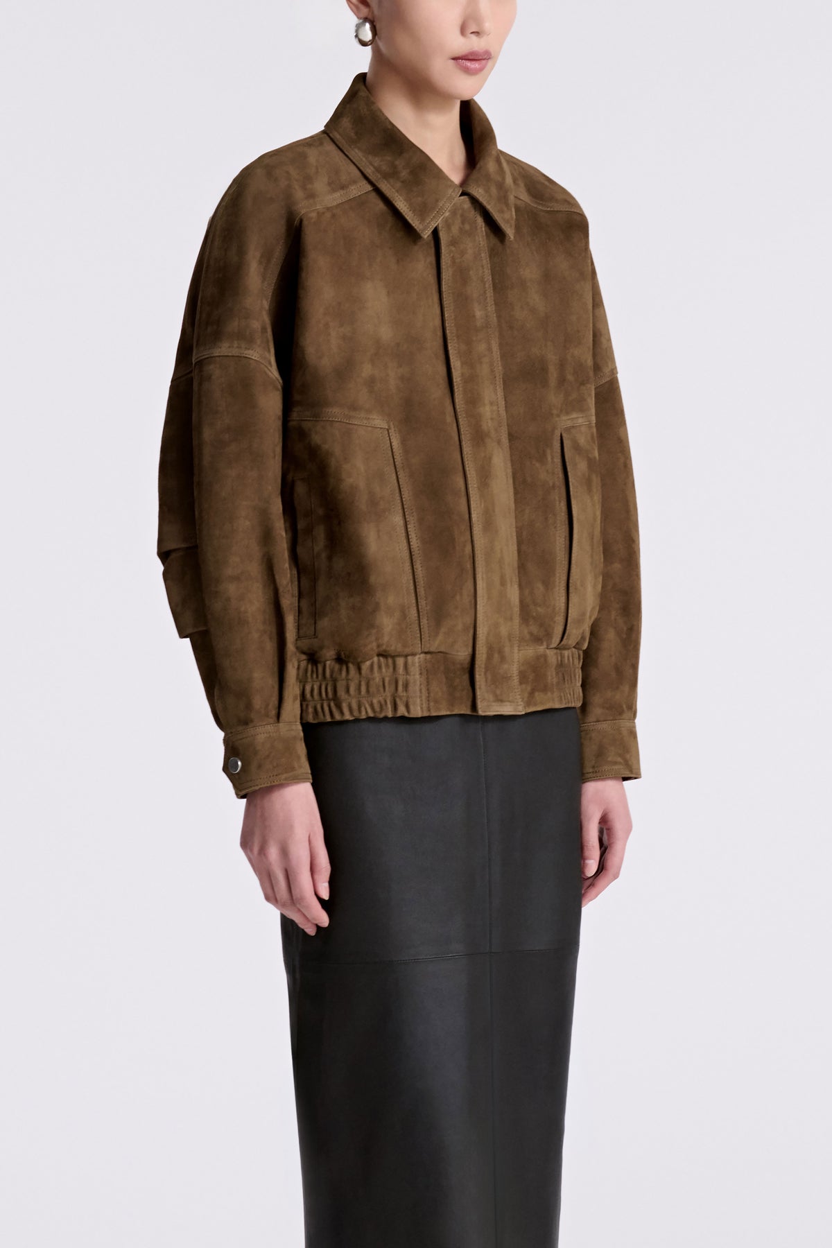 Model is Wearing Nour Hammour Dalma Menswear Suede Bomber Bark - Three Quarters