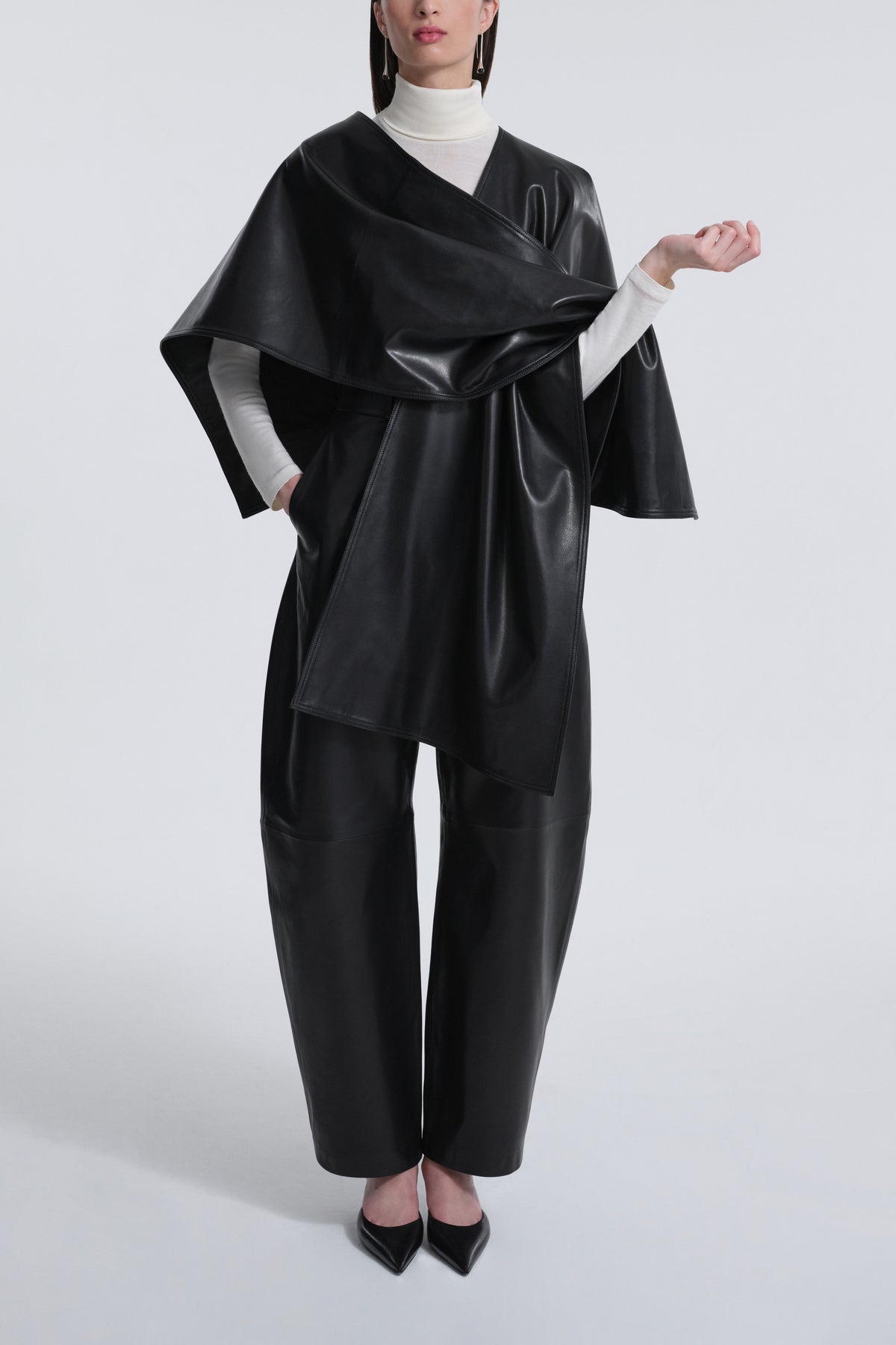 Model is Wearing Nour Hammour Edra Sleek Leather Cape Black - Front