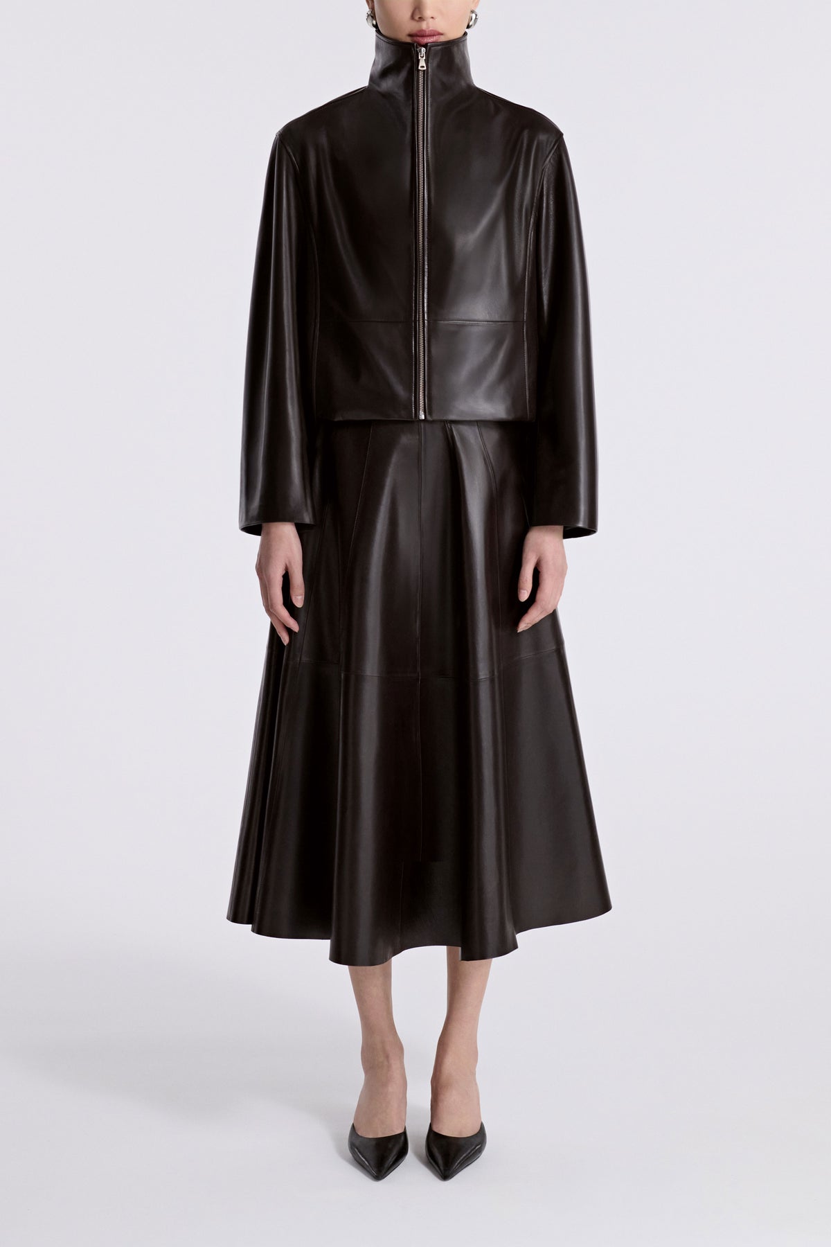 Model is Wearing Nour Hammour Etienne Funnel Neck Leather Jacket Dark Brown - Front 