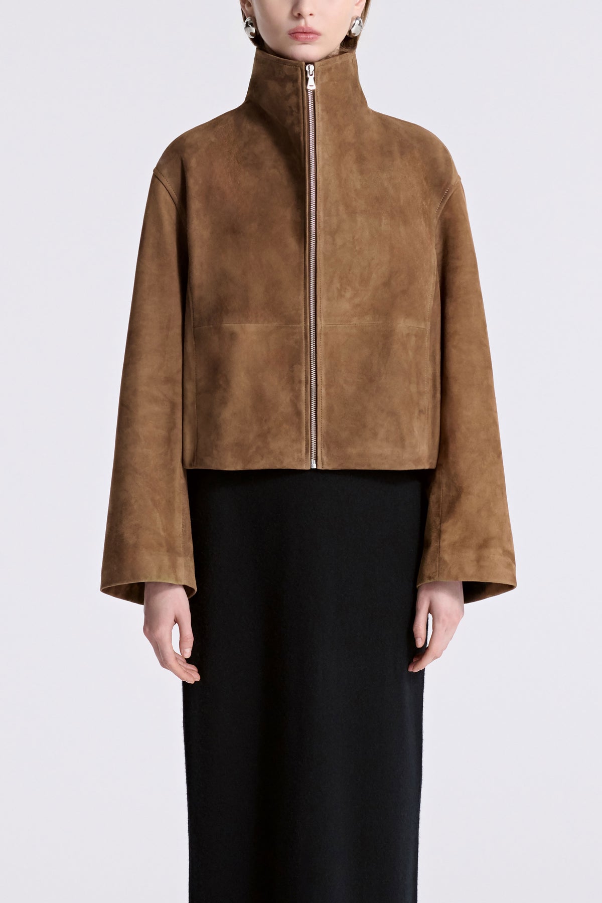 Model is Wearing Nour Hammour Etienne Funnel Neck Suede Jacket Tobacco - Front Closed 