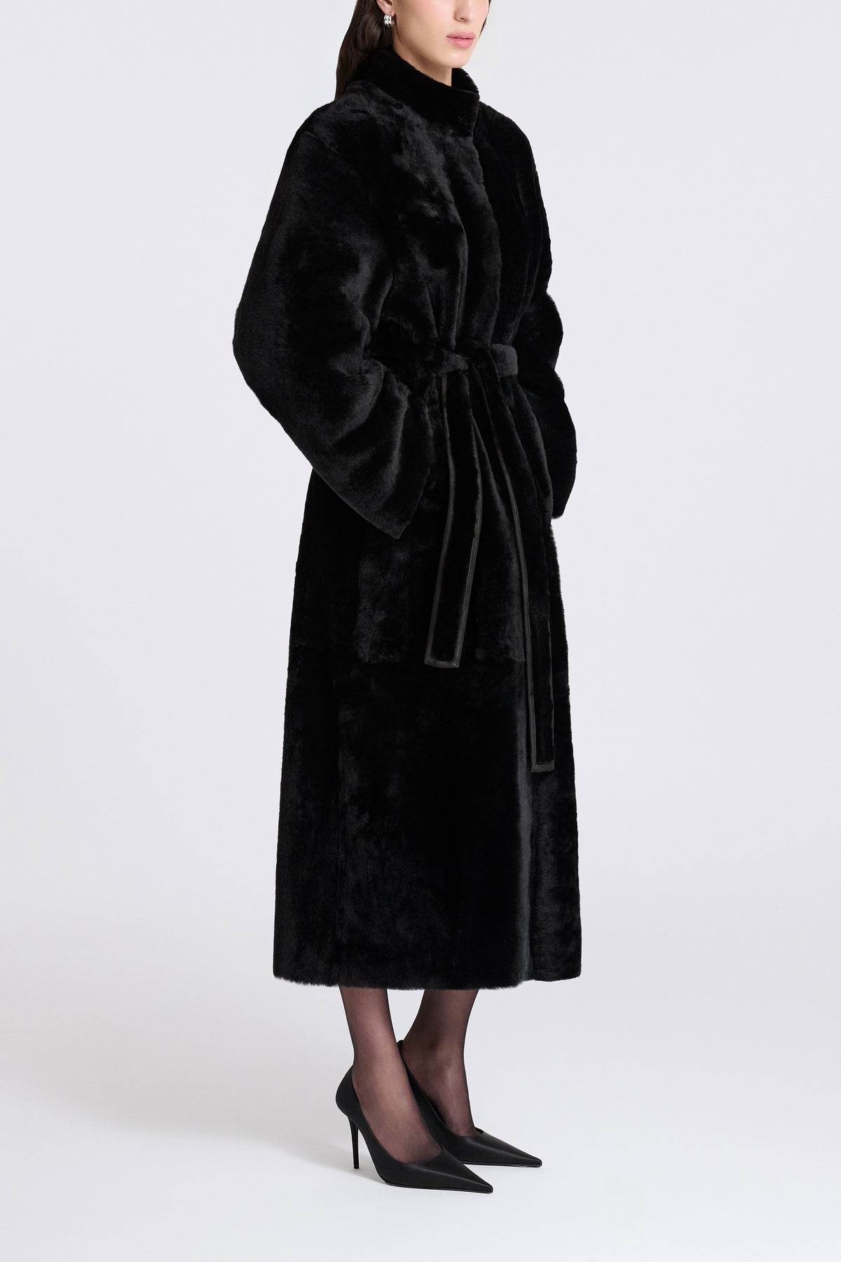 Model is Wearing Nour Hammour Grace Soft Merinos Shearling Coat Black Merinos - Three Quarters