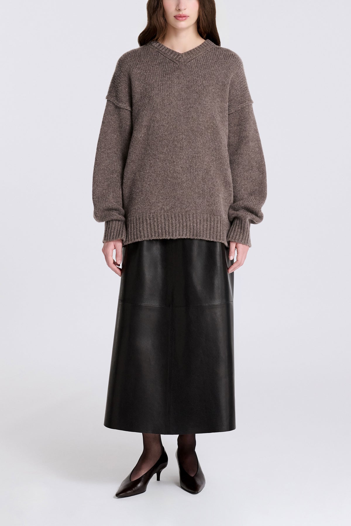 Model is Wearing Nour Hammour Jude  High V-Neck Cashmere Sweater Mink - Front