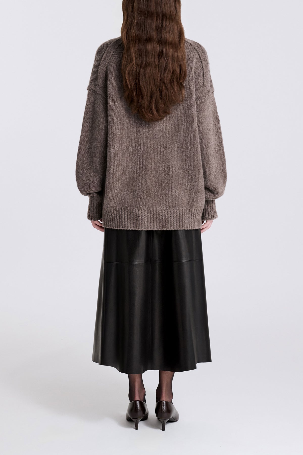 Model is Wearing Nour Hammour Jude  High V-Neck Cashmere Sweater Mink - Back