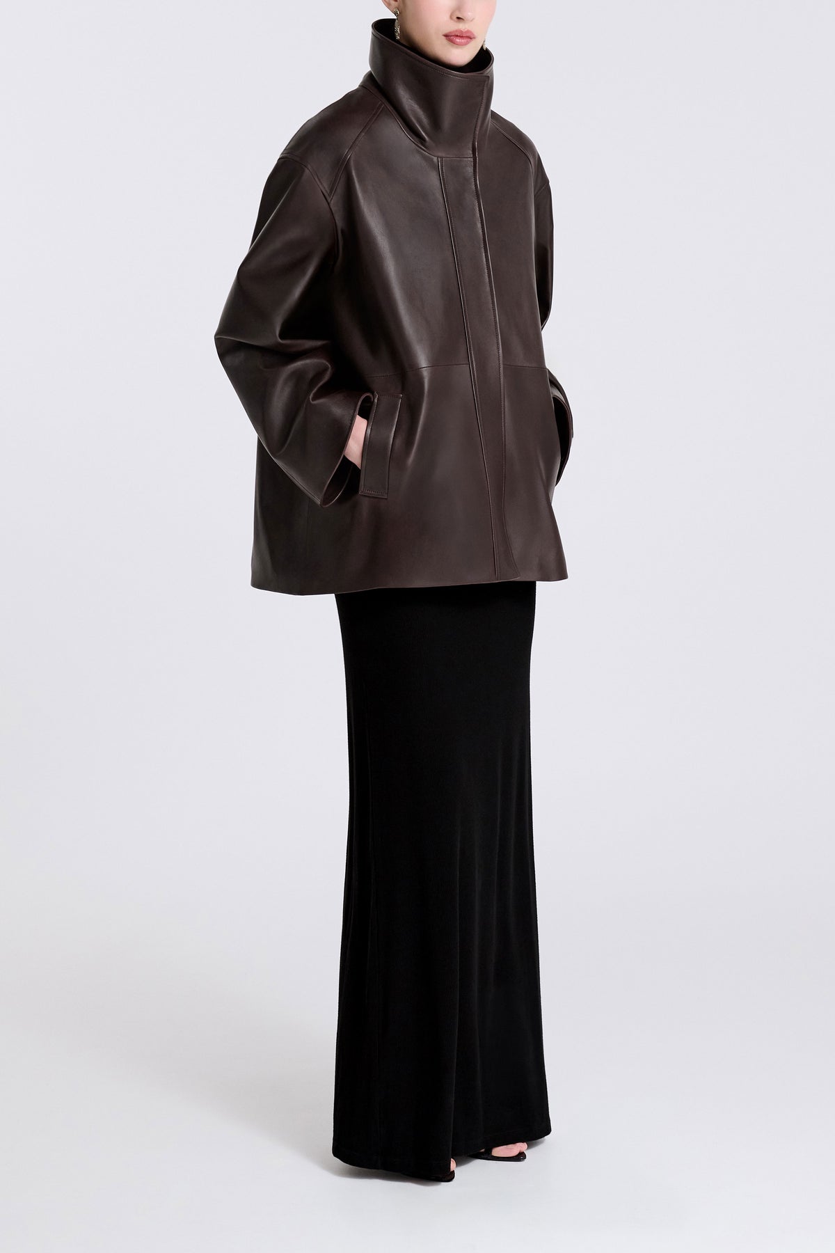 Model is Wearing Nour Hammour Lowen Sleek Funnel Neck Jacket Deep Brown - Three Quarters