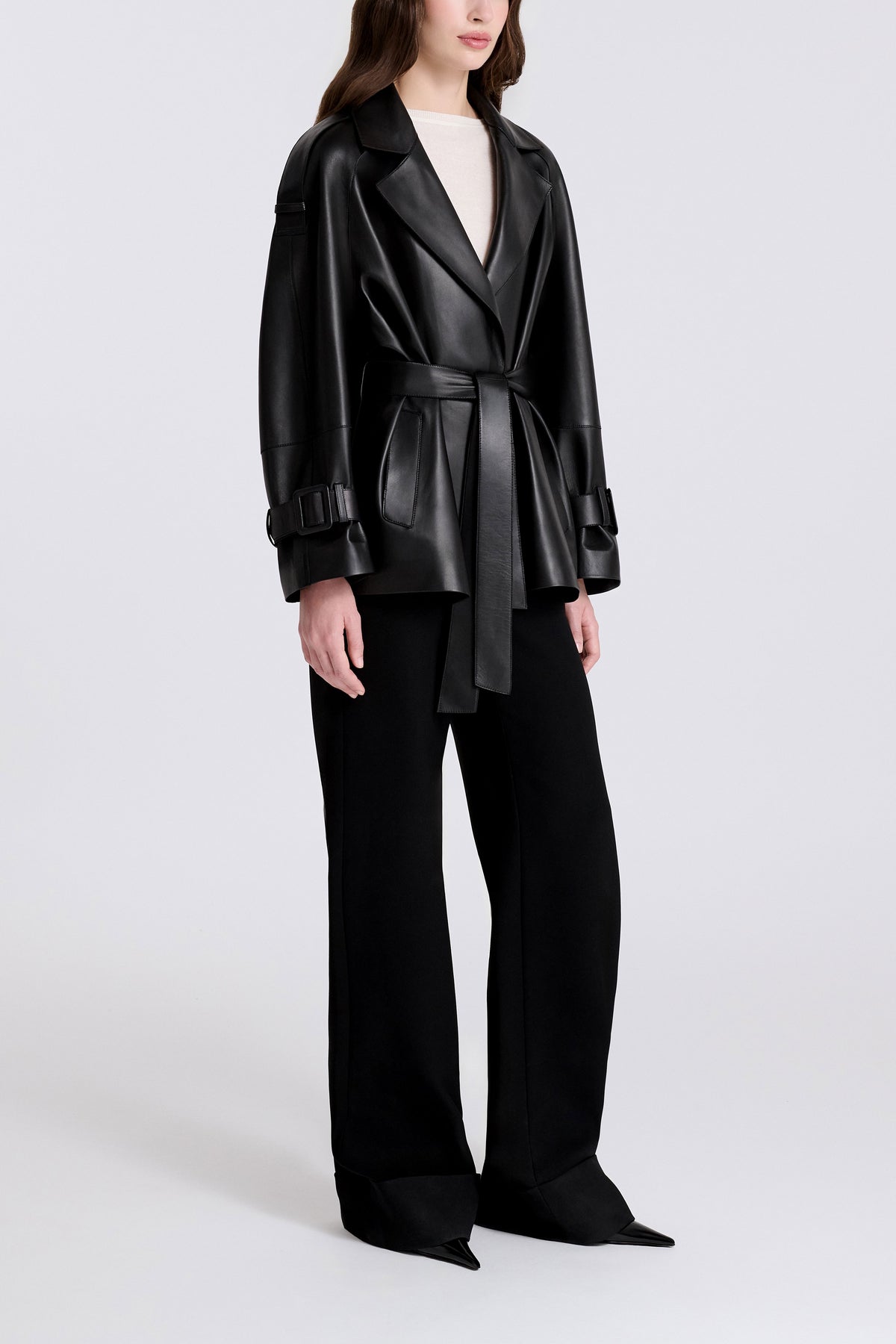 Model is Wearing Nour Hammour Nera Lightweight Cropped Leather Trench Black - Three Quarters