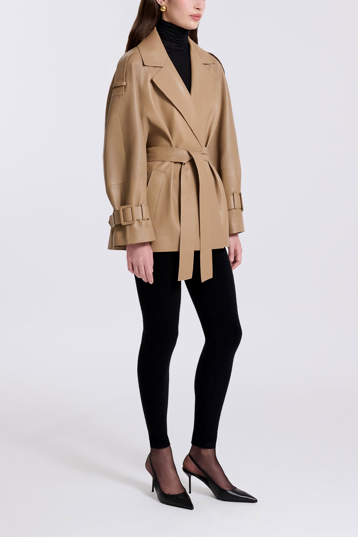 Model is Wearing Nour Hammour Nera Lightweight Cropped Leather Trench Raw Camel - Three Quarters 