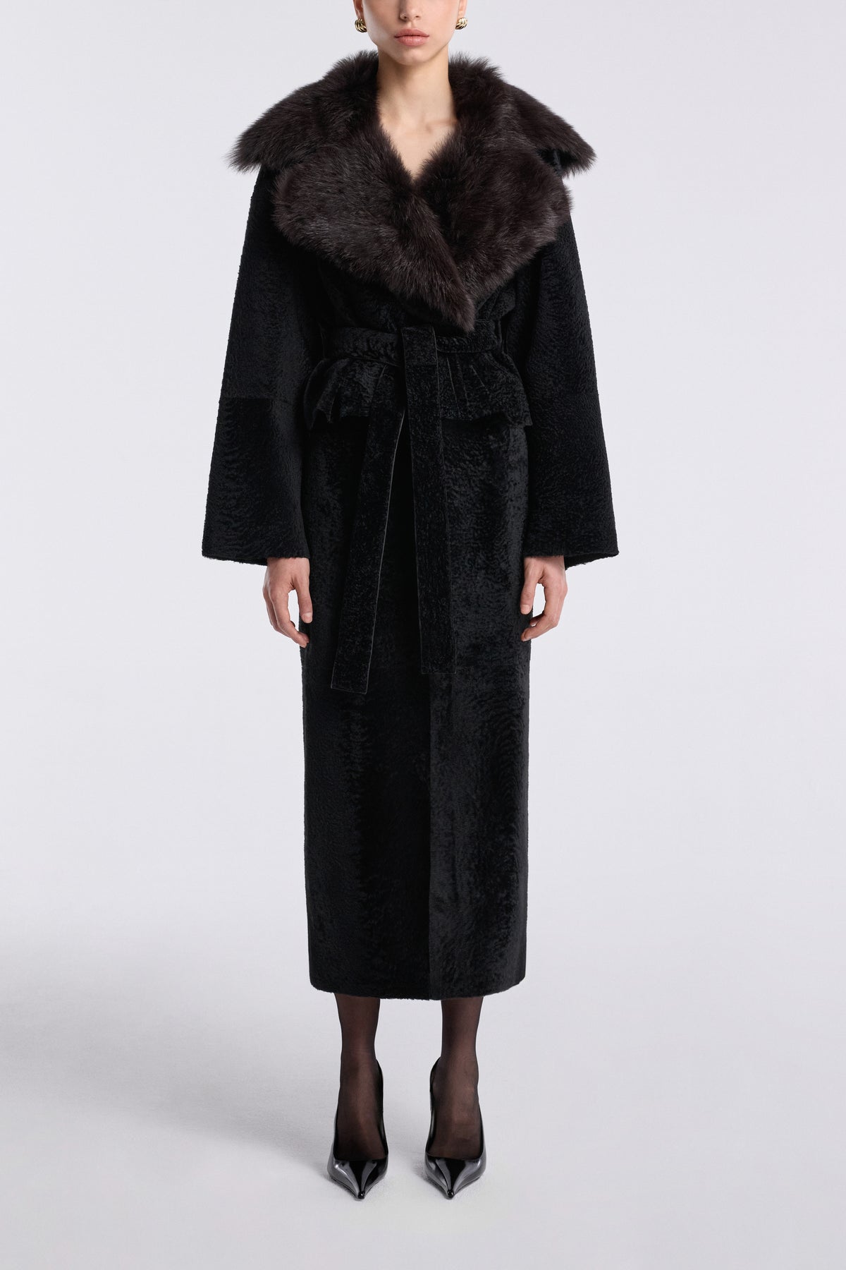 Model is wearing the Nour Hammour Renata Velvety Shearling Coat Noir Boheme - Front Closed