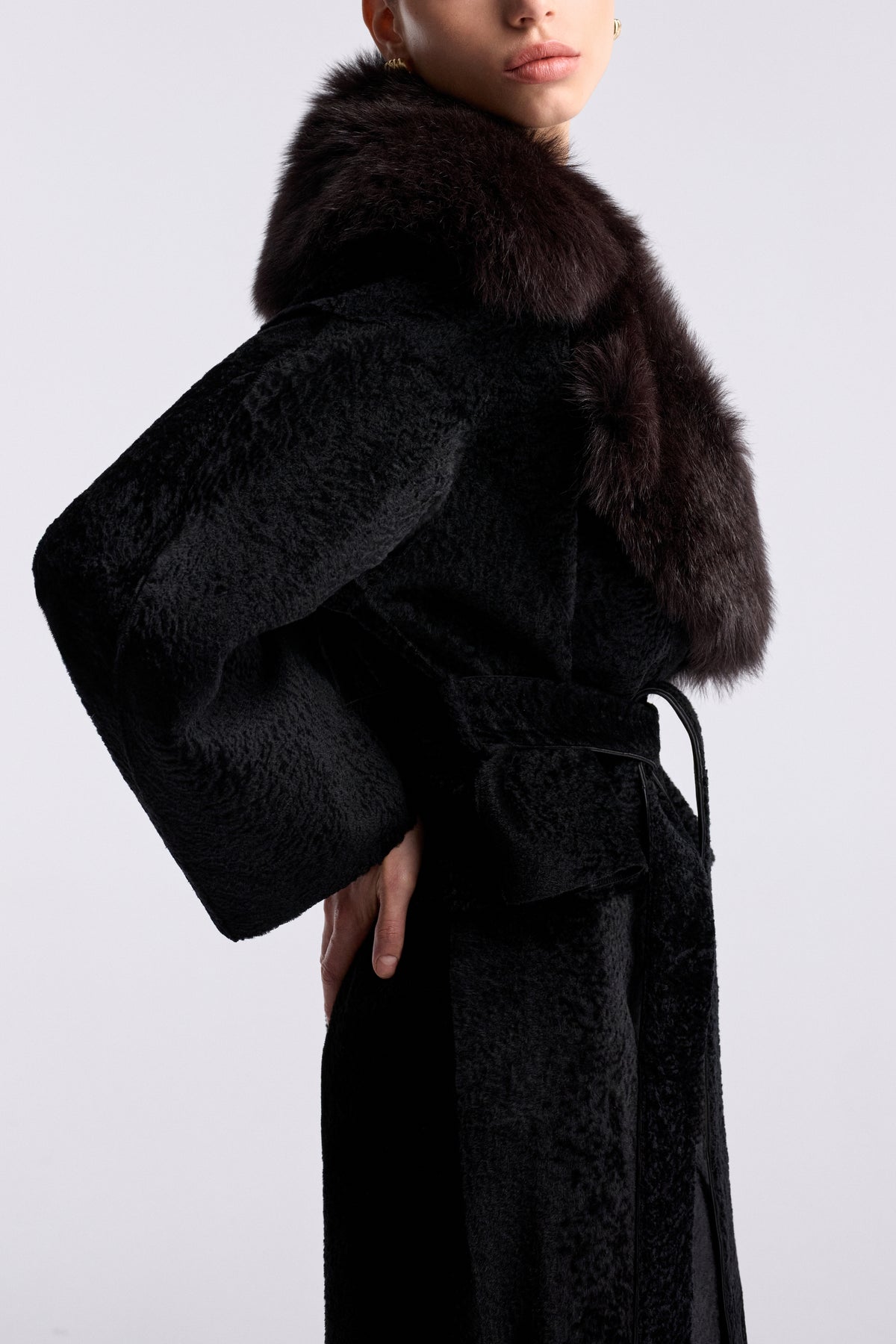 Model is wearing the Nour Hammour Renata Velvety Shearling Coat Noir Boheme - Detail