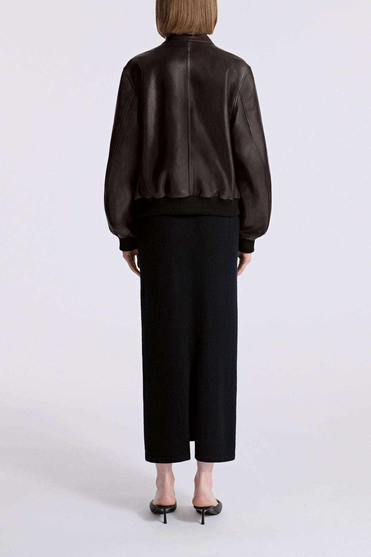 Model is Wearing Nour Hammour Rios Classic Leather Bomber Ebony Brown - Back