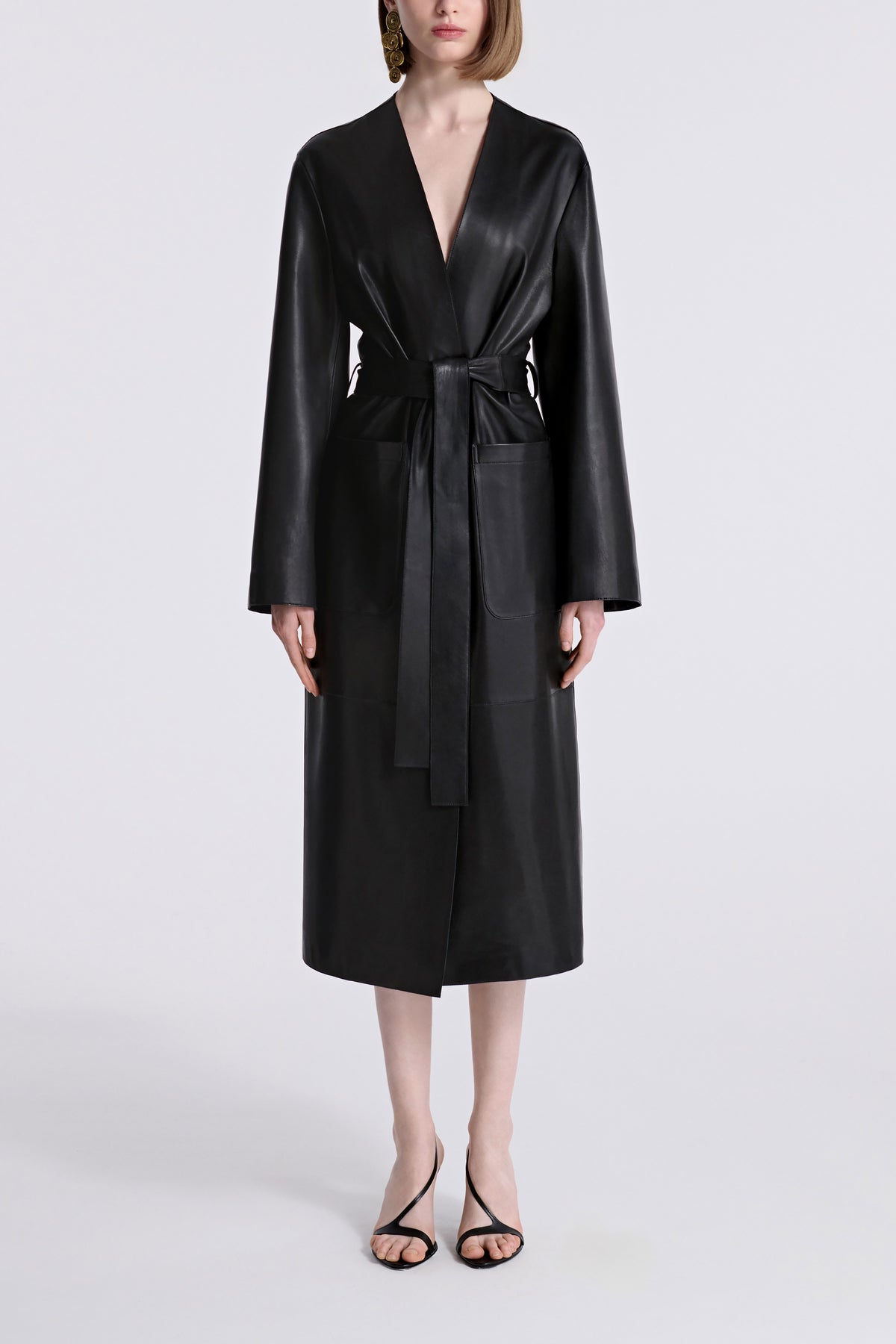 Model is Wearing Nour Hammour Ruelle Collarless Leather Trench Noir Classique - Front Closed