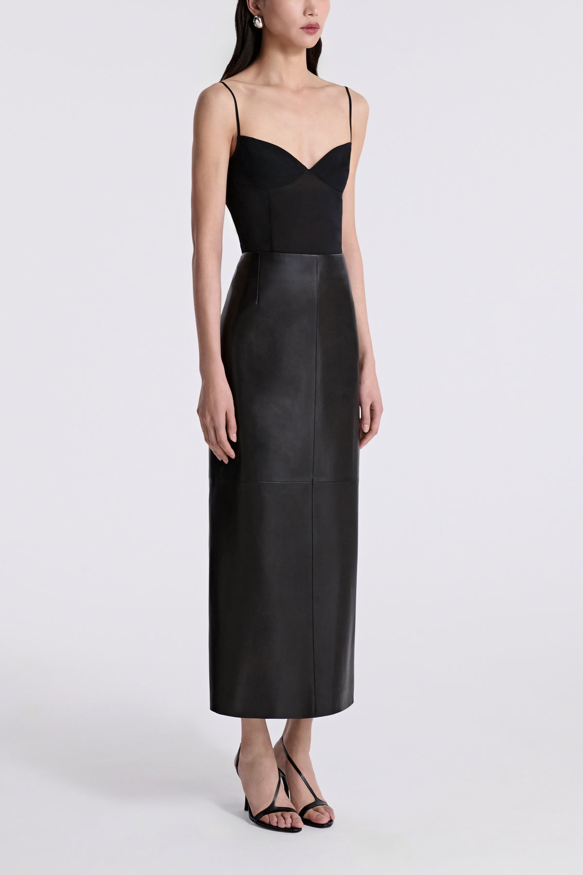Model is Wearing Nour Hammour Selly Leather Column Skirt Noir Classique - Three Quarters