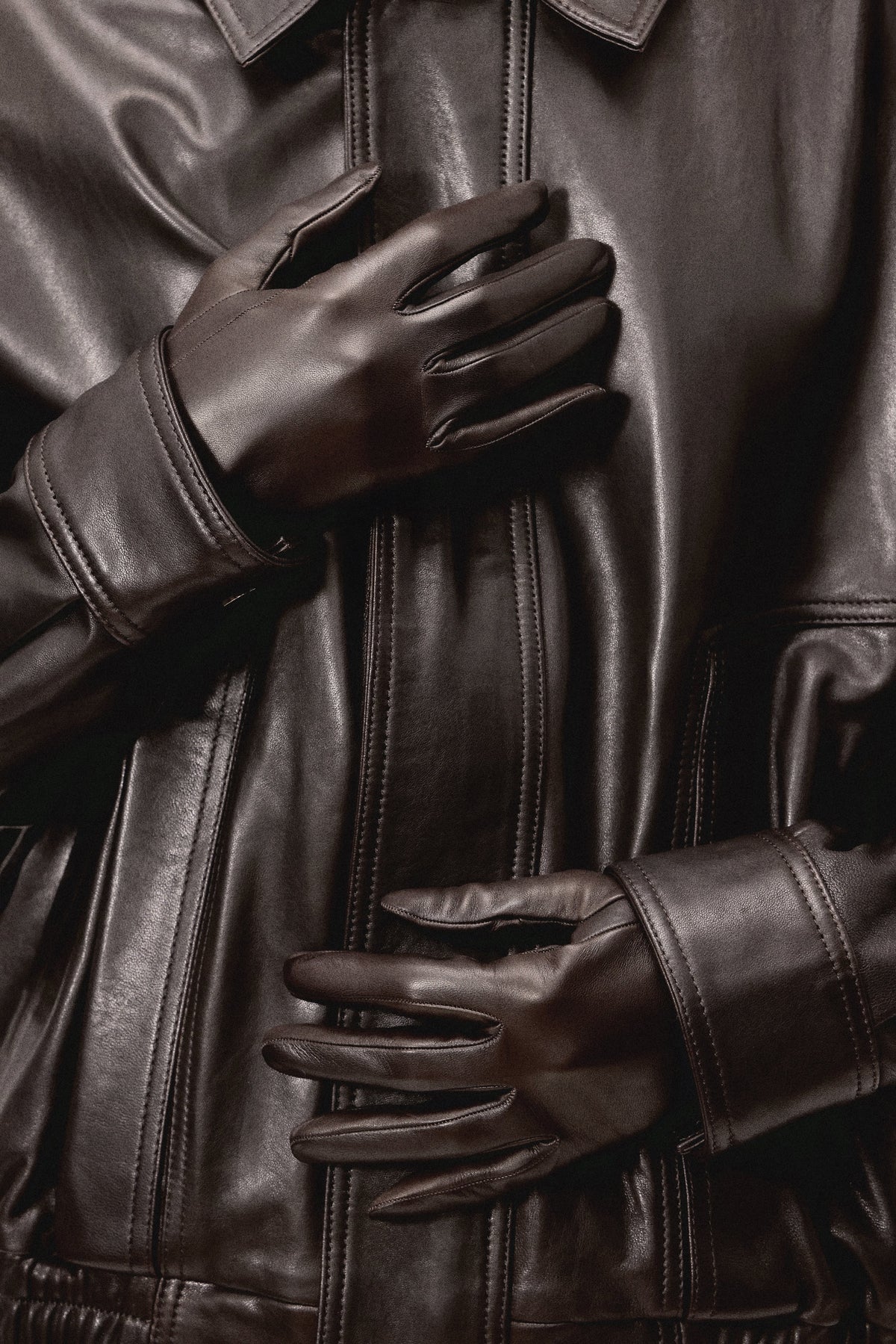 Model is Wearing Nour Hammour Wrislet Short Leather Gloves Chocolate - Close up