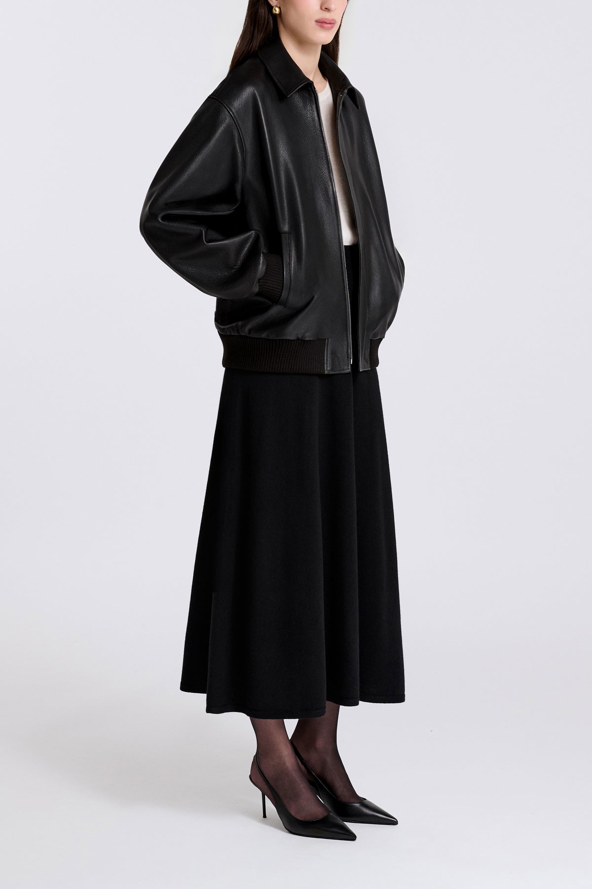 Model is Wearing Nour Hammour Toyen Classic Leather Bomber Black - Three Quarters 