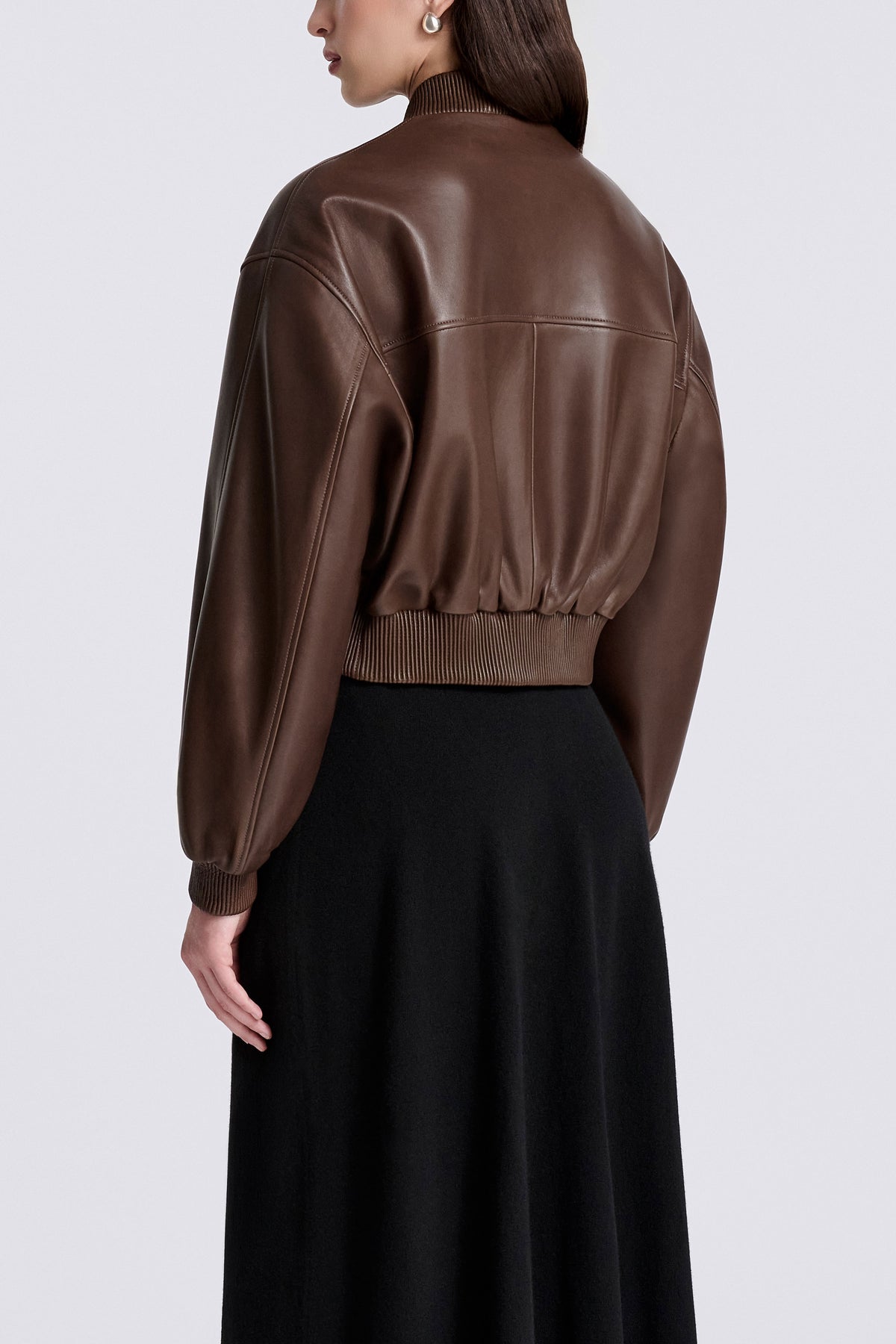 Model is Wearing Nour Hammour Wren Cropped Leather Bomber Marron Glace - Three Quarters Back