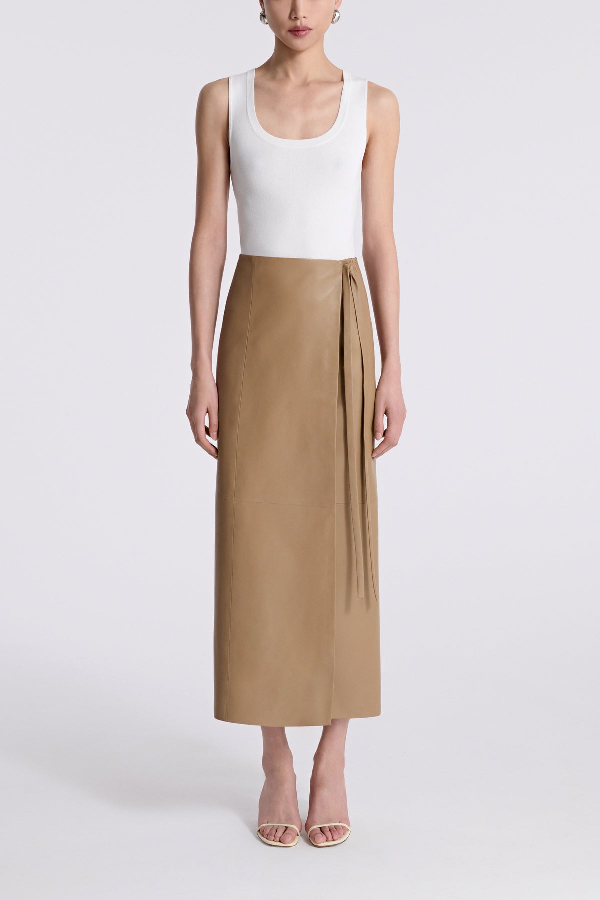 Model is Wearing Nour Hammour Wrap Tie Waist Leather Skirt Raw Camel - Front 