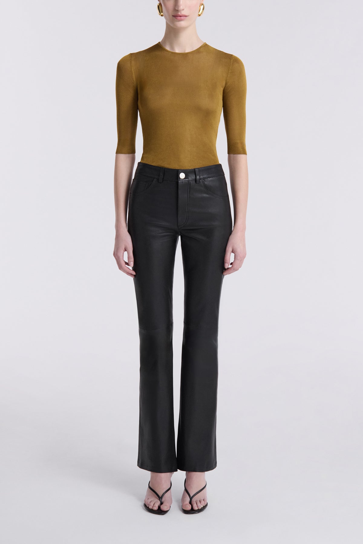 Model is Wearing the Nour Hammour Flare Stretch Leather Pants Black - Front