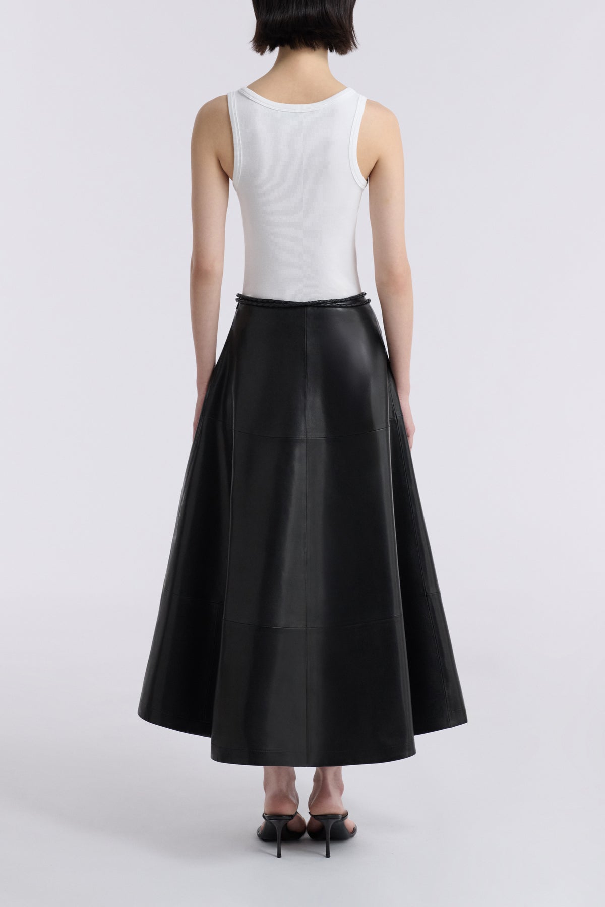 Model is Wearing Nour Hammour Opera Sweeping Leather Skirt Noir Classique - Back