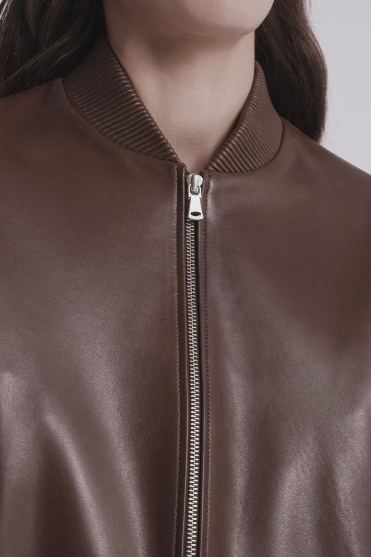 Model is Wearing Nour Hammour Wren Cropped Leather Bomber Marron Glace - Video Details 