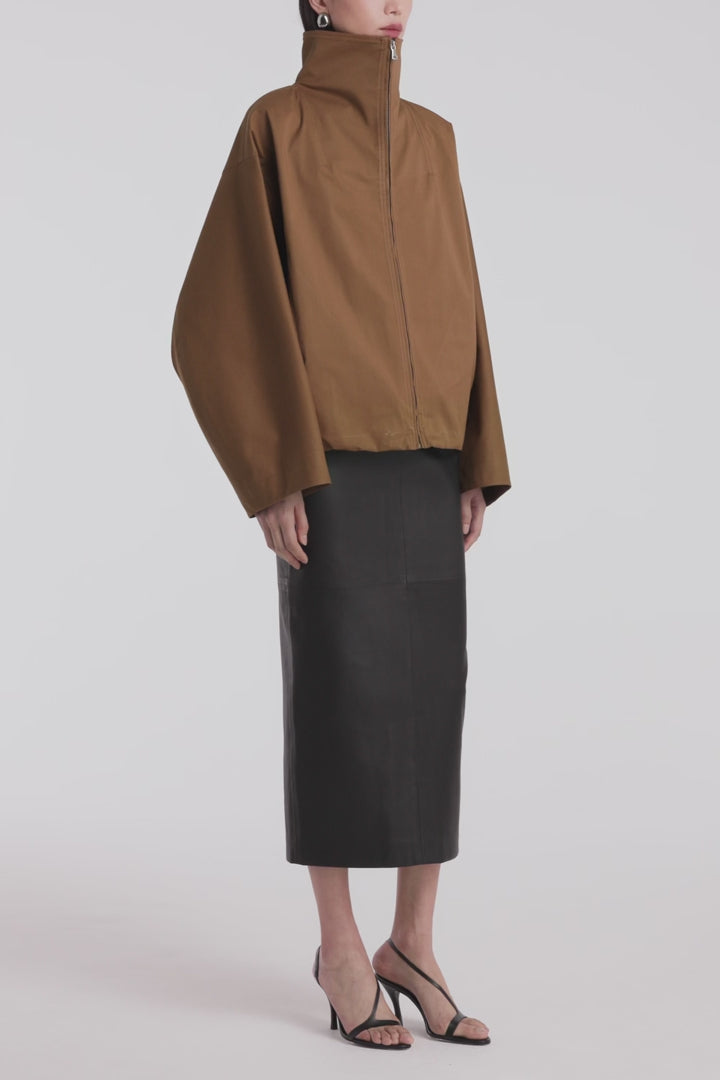 Model is Wearing Nour Hammour Francois Funnel Neck Cotton Bomber Camel - Video