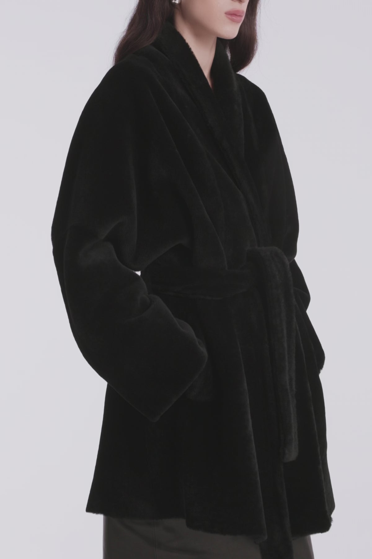 Model is Wearing Nour Hammour Raquel Fluid Merinos Shearling Coat Black - Video Details 
