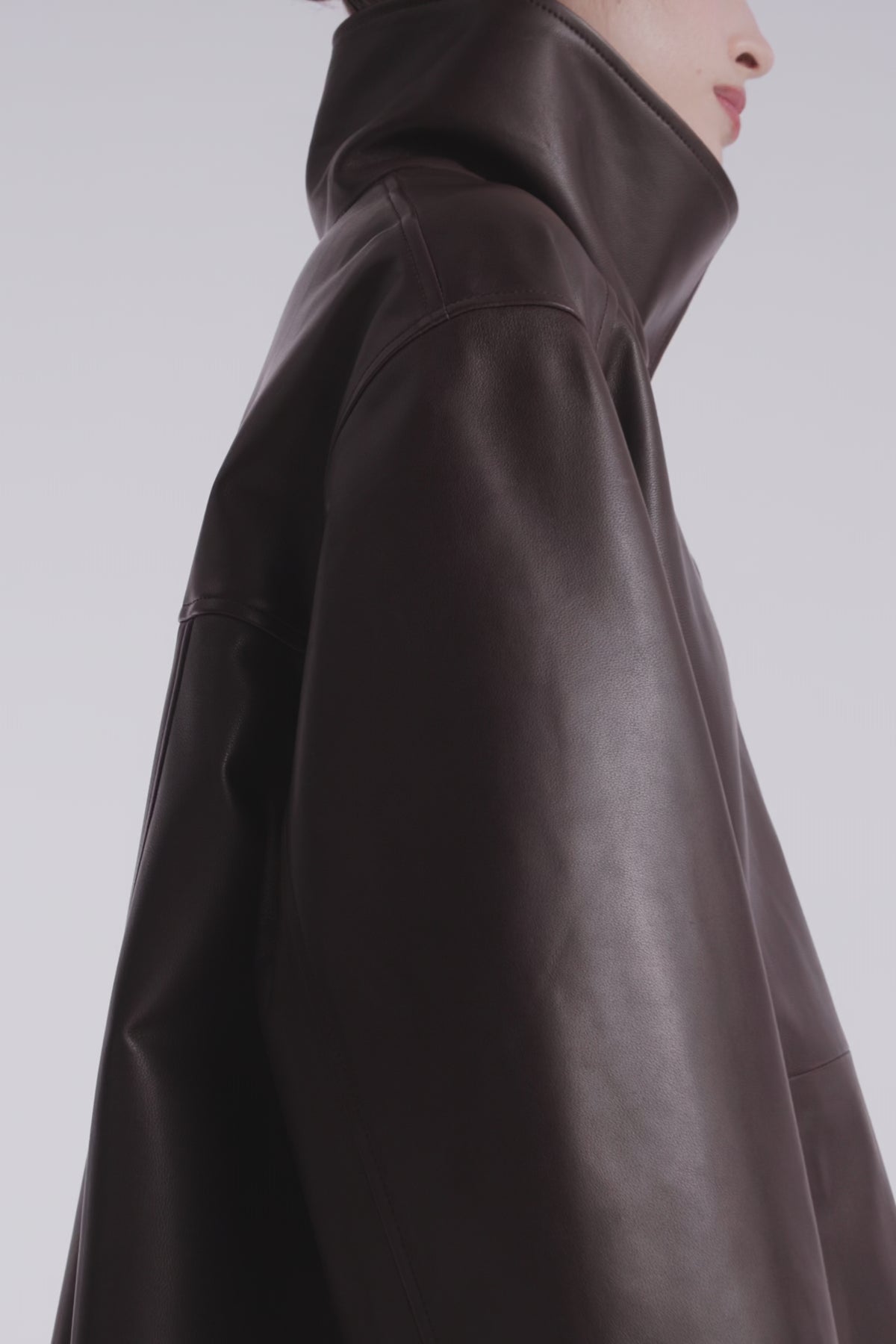 Model is Wearing Nour Hammour Lowen Sleek Funnel Neck Jacket Deep Brown - Video Details 