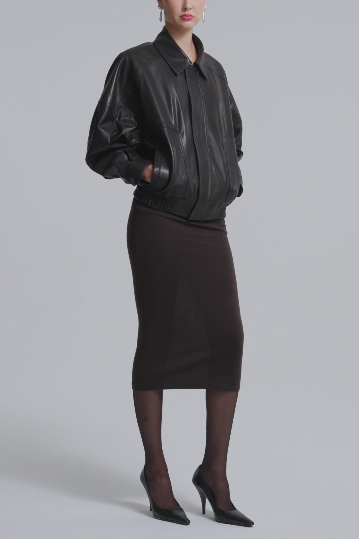 Model is Wearing Nour Hammour Dalma Menswear Leather Bomber Black - Video