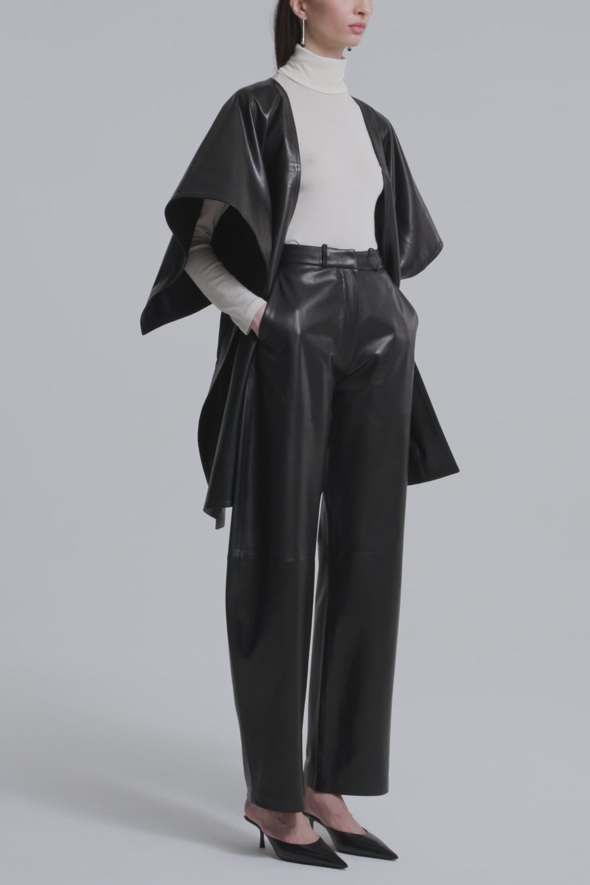 Model is Wearing Nour Hammour Edra Sleek Leather Cape Black - Video
